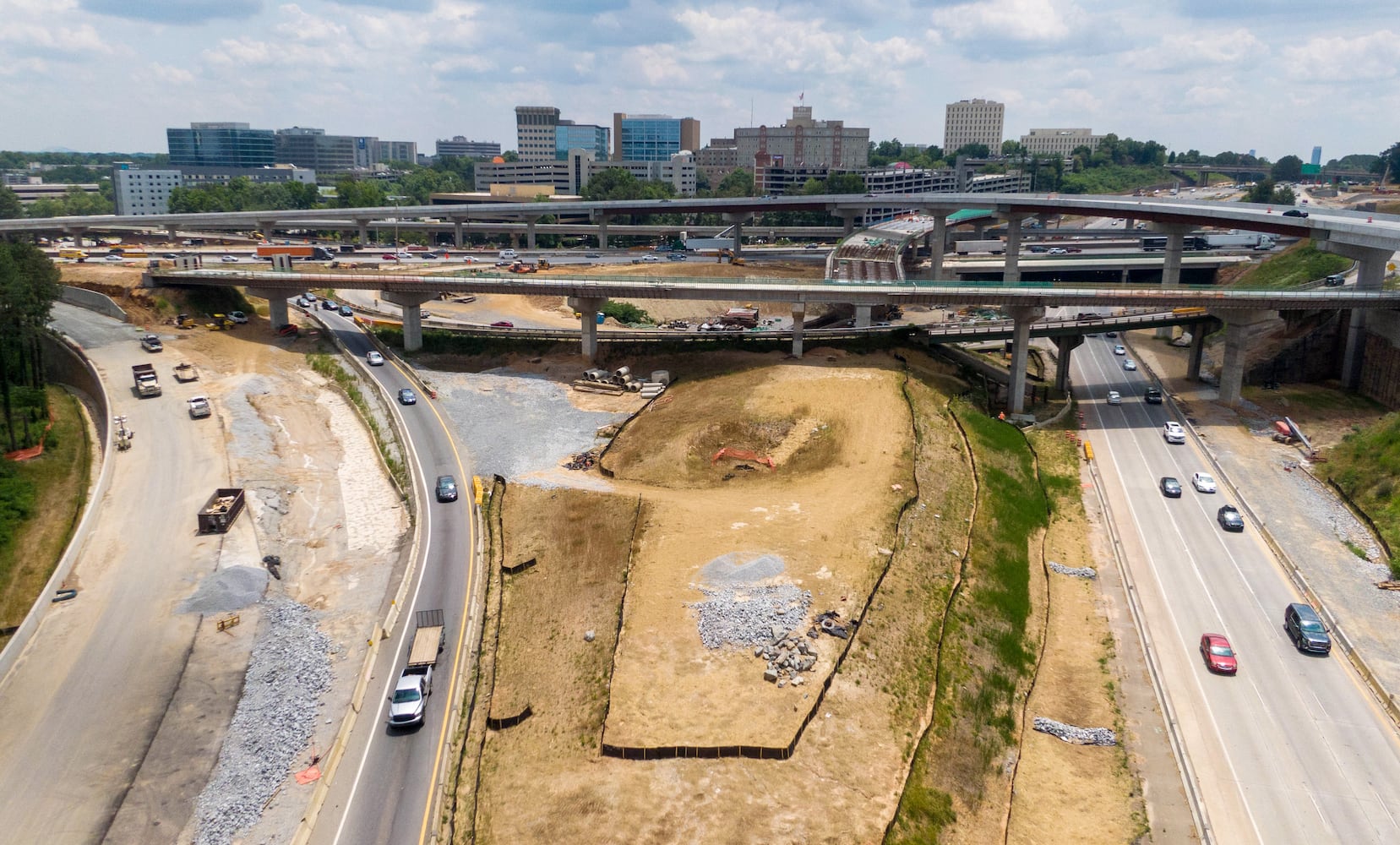 May 27, 2021 Sandy Springs - Aerial photo shows construction site of I-285 interchange at Ga. 400 in Sandy Springs on Tuesday, May 27, 2021. (Hyosub Shin / Hyosub.Shin@ajc.com)