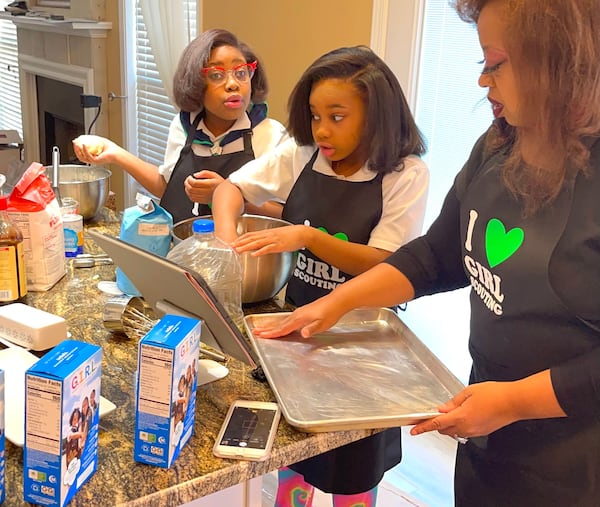 Leigha (from left), Lundyn and Michele Samuel bake their own version of the 1922 recipe for Girl Scout Cookies. Courtesy of Michele Samuel