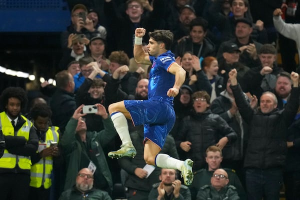 Chelsea's Pedro Neto celebrates after scoring his side's first goal during the English Premier League soccer match between Chelsea and Arsenal at Stamford Bridge stadium in London, Sunday, Nov. 10, 2021. (AP Photo/Kirsty Wigglesworth)