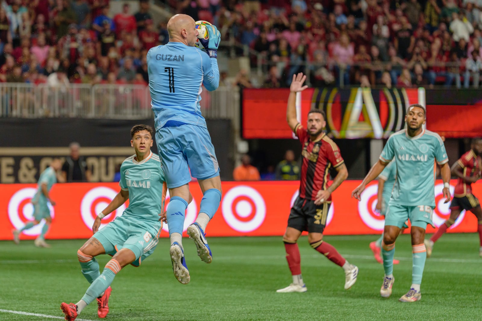 Atlanta United goalkeeper Brad Guzan (1) saves the ball during the first half of an MLS soccer match against Inter Miami, Saturday, Nov. 2, 2024, in Atlanta. (AP Photo/Jason Allen)