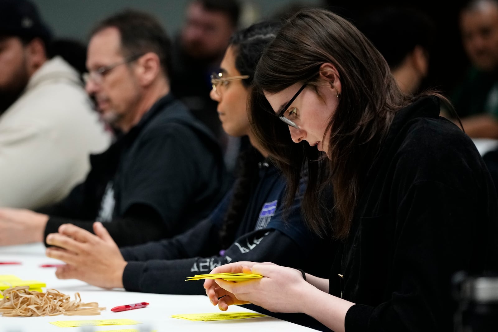 Volunteers tally votes on a new contract offer from Boeing, Wednesday, Oct. 23, 2024, at Seattle Union Hall in Seattle. (AP Photo/Lindsey Wasson)