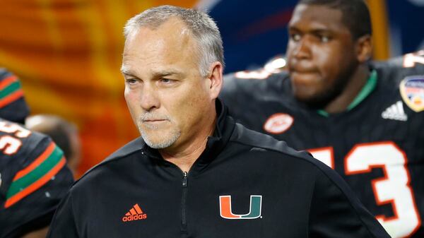 Miami head coach Mark Richt enters the field during the second half of the Orange Bowl against Wisconsin, Saturday, Dec. 30, 2017, in Miami Gardens, Fla.