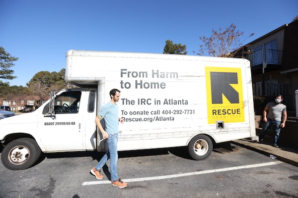 Logistic specialists Clay Hartzog and Jonathon Howard arrive at another location furnish a second apartment that will be ready the same day for the arrival of another Afghan refugee family on Wednesday, December 1, 2021. Miguel Martinez for The Atlanta Journal-Constitution 