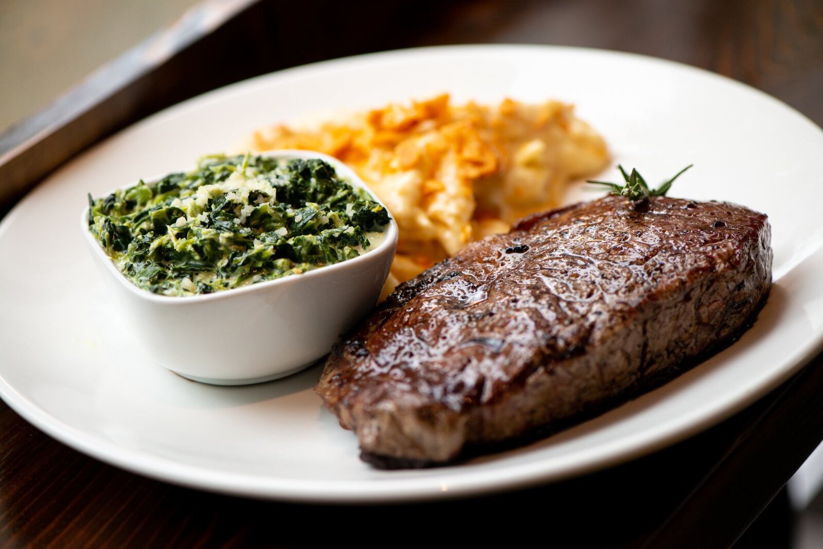 Cast Iron Ribeye with pan butter and two sides. Photo credit- Mia Yakel.