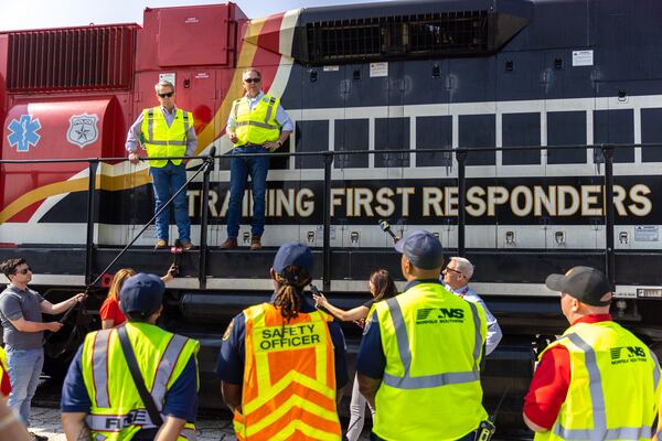 (Top L-R) Gov. Brian Kemp and Norfolk Southern President Alan Shaw speak at a first responder training at Norfolk Southern’s East Point rail yard on Tuesday, June 6, 2023. (Arvin Temkar / arvin.temkar@ajc.com)