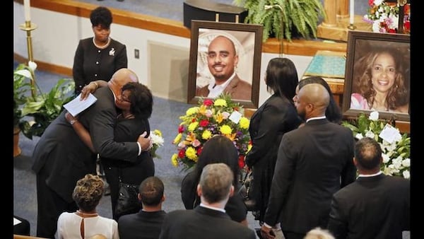 Guests pay their respects to family members at the “Celebration of Life” service for Christopher Redding Edwards II, Erin Victoria Edwards, and their mother, Dr. Marsha Edwards at Cascade United Methodist Church in Atlanta on Wednesday, August 28, 2019.