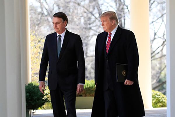 Brazilian President Jair Bolsonaro, left, plans to  chat with President Donald Trump about tariffs.