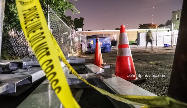 This was the scene from the back alley behind a recording studio on Manchester Street in Atlanta where a man was killed overnight. JOHN SPINK / JSPINK@AJC.COM