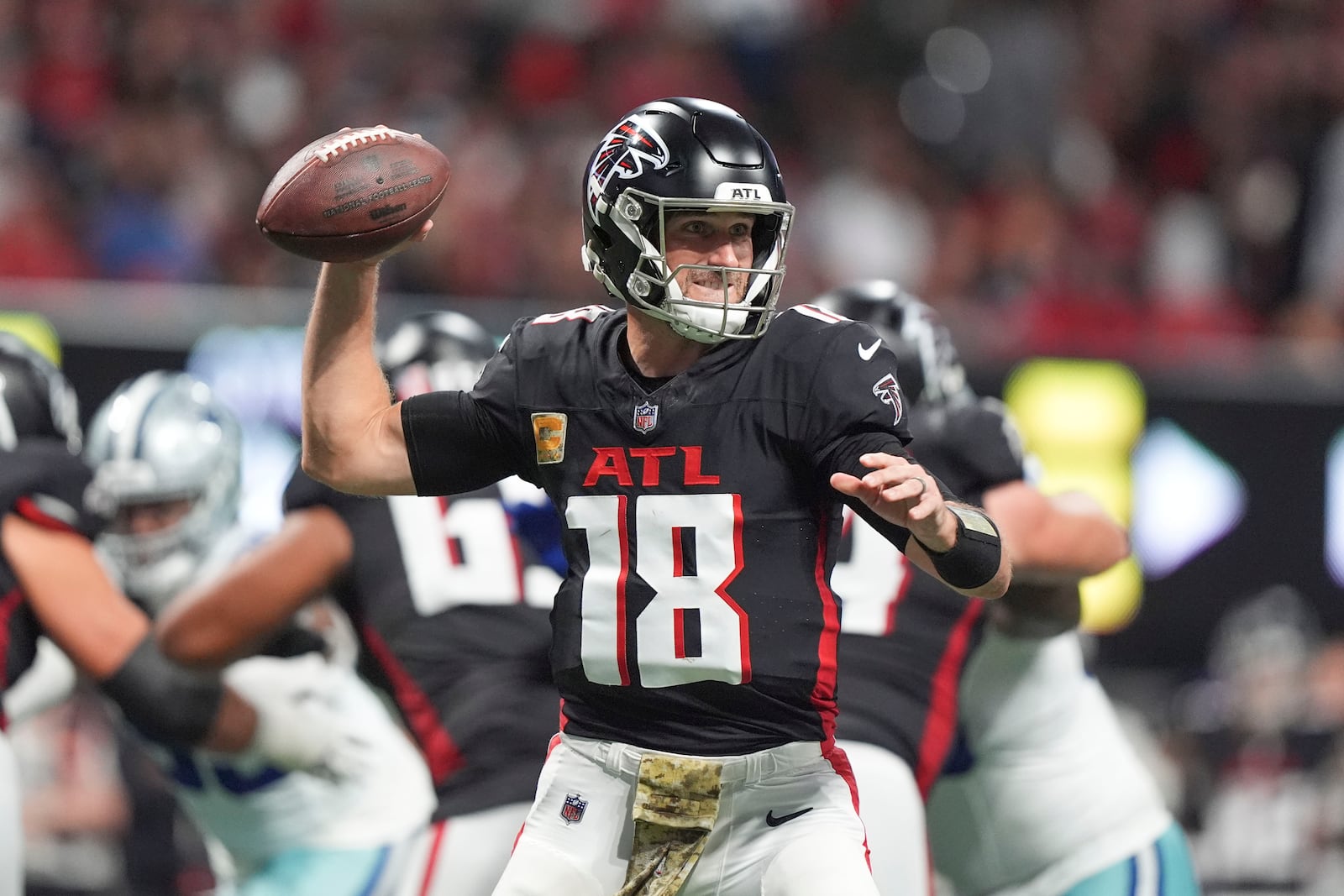 Atlanta Falcons quarterback Kirk Cousins (18) passes during the second half of an NFL football game against the Dallas Cowboys, Sunday, Nov. 3, 2024, in Atlanta. (AP Photo/ Brynn Anderson)