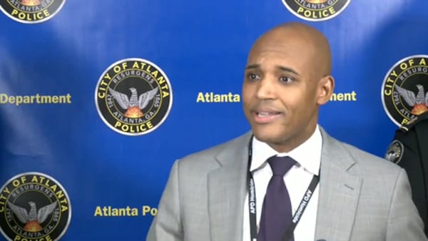 Lt. Ralph Woolfolk, commander of Atlanta police's homicide unit, addresses reporters during a news conference Friday.