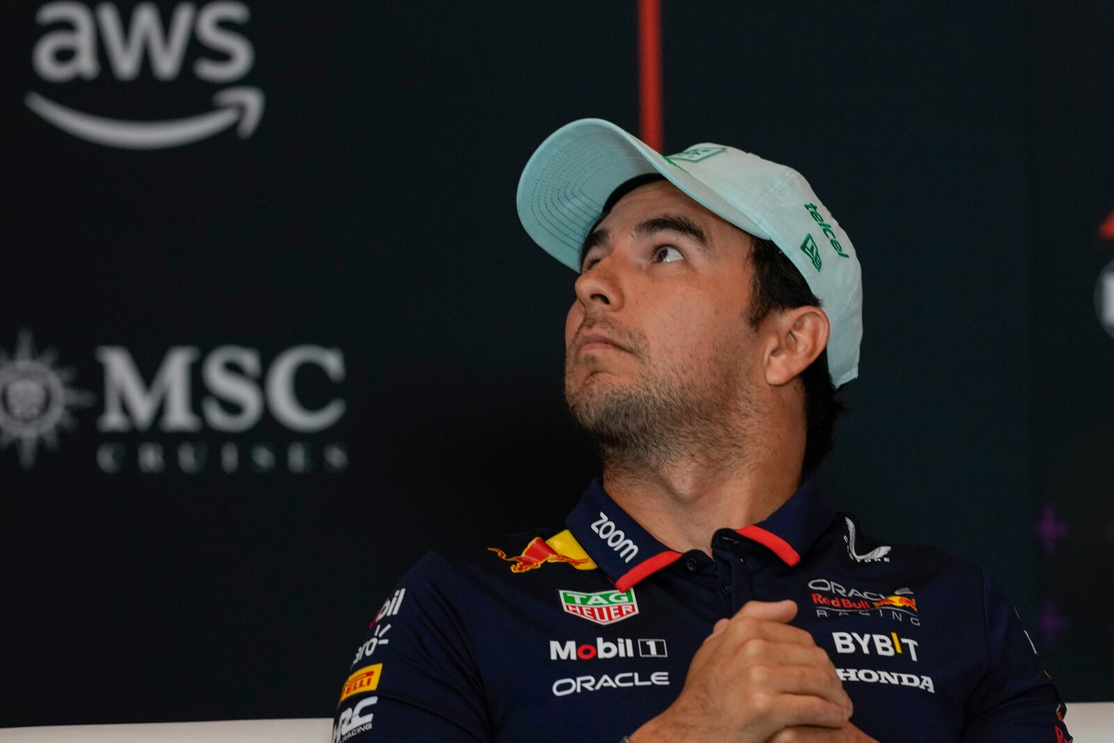 Red Bull driver Sergio Perez of Mexico looks up during a press conference at Hermanos Rodriguez racetrack ahead of the Formula One Mexico Grand Prix in Mexico City, Thursday, Oct. 24, 2024. (AP Photo/Moises Castillo)