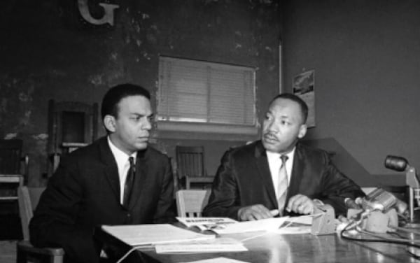 Andrew Young and the Rev. Martin Luther King Jr. appeared at a press conference at the Prince Hall Masonic Lodge on Nov. 2, 1964. (Handout)