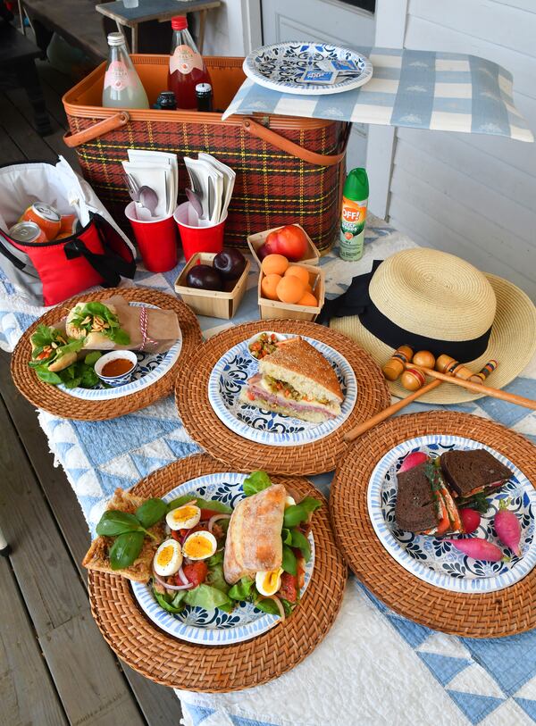 If you're preparing for a picnic, great options include Muffuletta (upper middle), Swedish Picnic Loaf (bottom right), Pan Bagnat (bottom left) and Vietnamese Beach Baguette (upper left). (Styling by Lisa Hanson / Chris Hunt for the AJC)