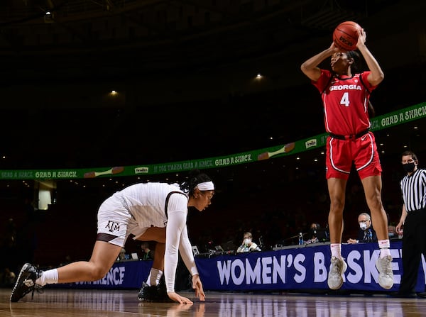 Georgia's Mikayla Coombs (4) snags a pass over a Texas A&M defender during their SEC women's tournament game Saturday, March 6, 2021, in Greenville, S.C. (Todd Van Emst/SEC)