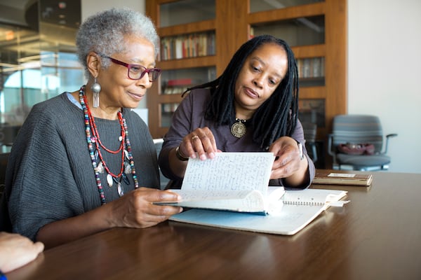 Alice Walker, left, and Valerie Boyd explore Walker’s archive in Emory University's Rose Library in 2015. Photo courtesy of Emory Photo/Video