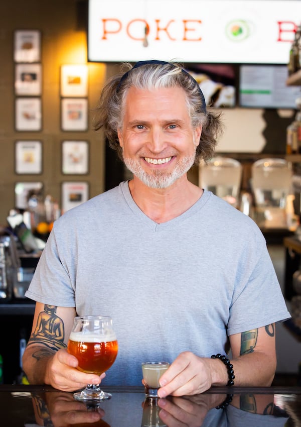 Taps @ Ph'East bartender Jeffrey Beavers serves The Juice Is Loose, featuring Tropicalia and a shot of sake. Ryan Fleisher for The Atlanta Journal-Constitution