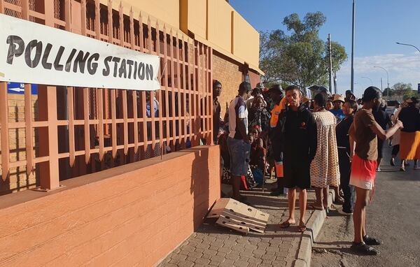 Namibians queue to cast their votes in a presidential election in Windhoek, Namibia Wednesday, Nov. 27, 2024. (AP Photo/Dirk Heinrich)