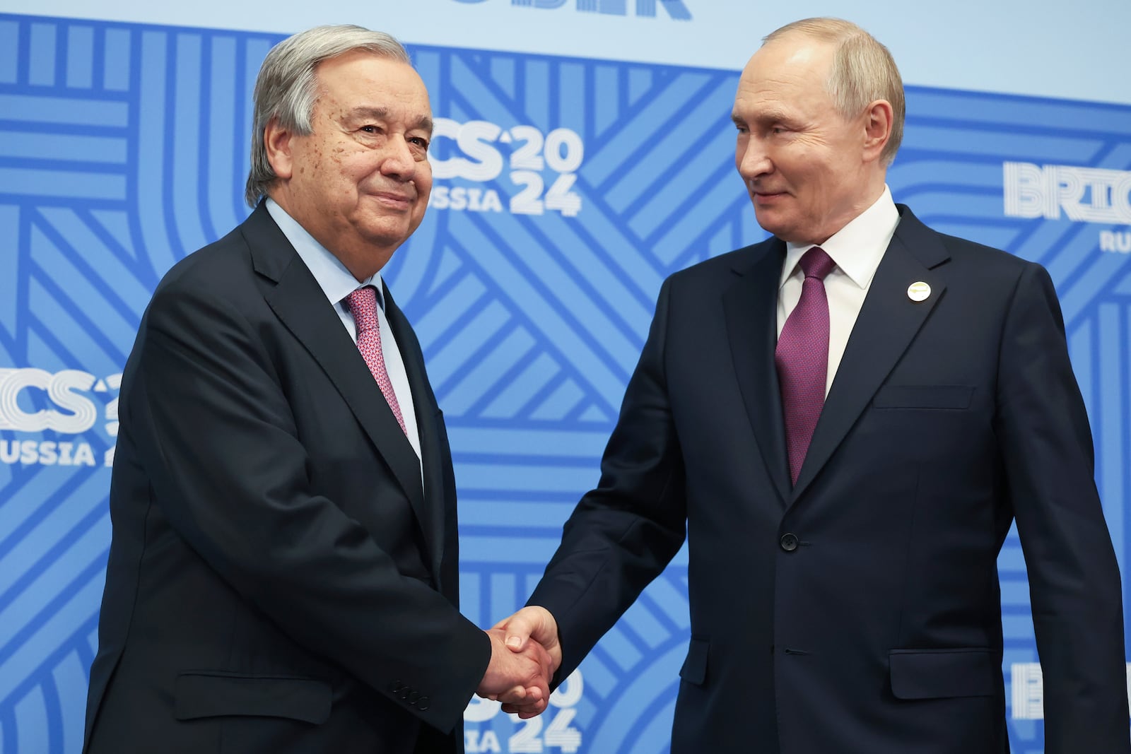 United Nations Secretary-General Antonio Guterres and Russian President Vladimir Putin shake hands during a meeting on the sidelines of the BRICS Summit in Kazan, Russia, Thursday, Oct. 24, 2024. (Alexander Kazakov, Sputnik, Kremlin Pool Photo via AP)