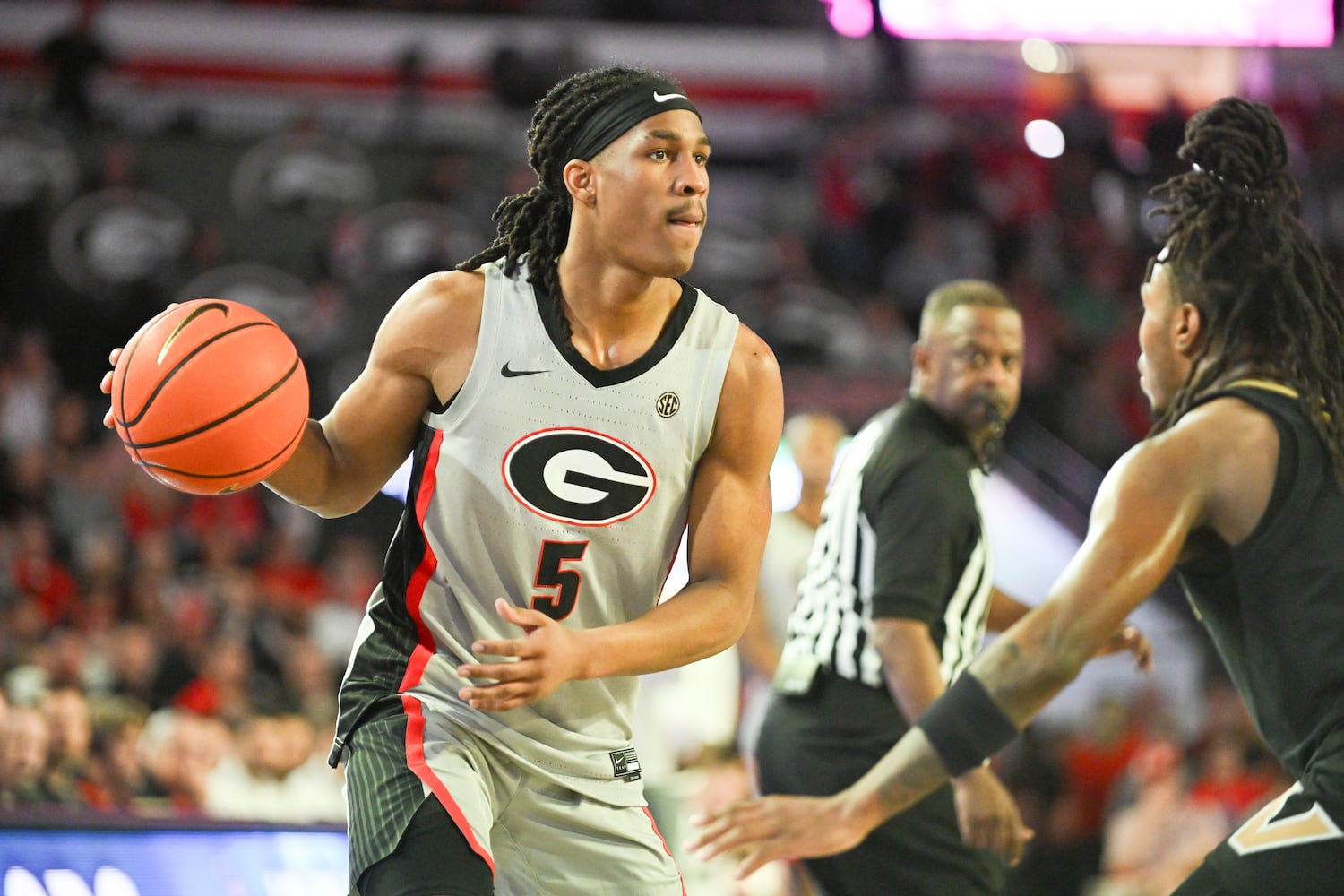 Georgia guard Silas Demary Jr. (5) looks for an opening in Vanderbilt’s defense during the first half of an NCAA Basketball game Saturday, March 8, 2025 at Stegeman Coliseum in Athens. (Daniel Varnado/For the Atlanta Journal-Constitution)