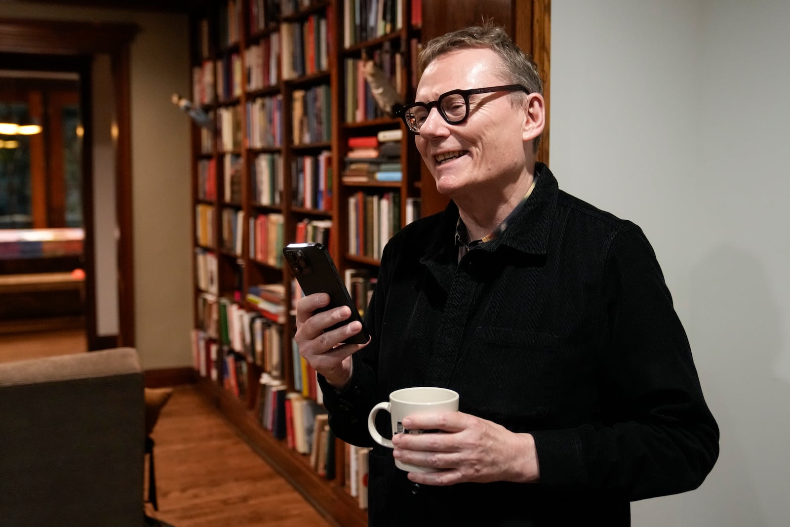 Nobel prize winner in Economics, James A. Robinson, gives an interview to the Associated Press from his home in the Hyde Park neighborhood of Chicago, Monday, Oct. 14, 2024. (AP Photo/Charles Rex Arbogast)