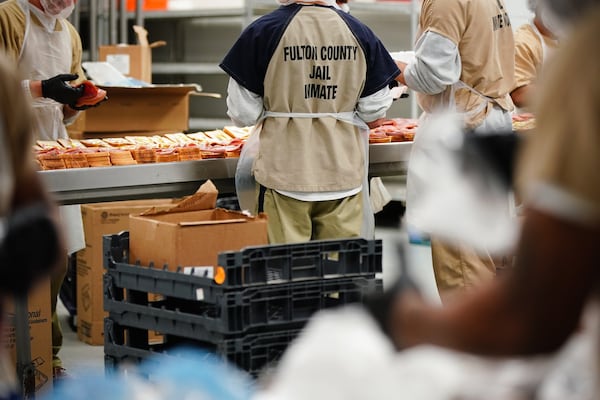 Inmates are seen preparing sandwiches for lunch in the kitchen during a tour of the Fulton County Jail on Monday, December 9, 2019, in Atlanta. (Elijah Nouvelage/Special to the Atlanta Journal-Constitution)