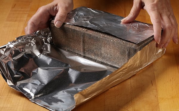 Wrap the bricks first in heavy foil. (Lisa Schumacher/food styling) (E. Jason Wambsgans/Chicago Tribune/TNS)