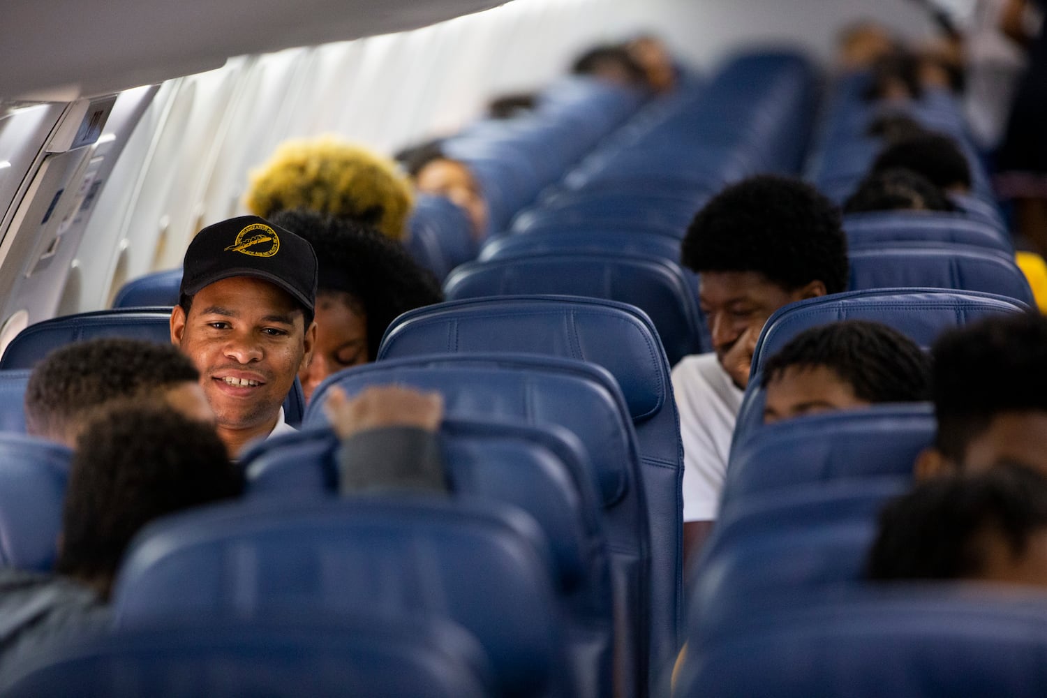 Participants of Delta’s Dream Flight 2022 get settled in their seats aboard a plane at Hartsfield-Jackson Atlanta International Airport on Friday, July 15, 2022. Around 150 students ranging from 13 to 18 years old will fly from Atlanta to the Duluth Air National Guard Base in Duluth, Minnesota. (Chris Day/Christopher.Day@ajc.com)