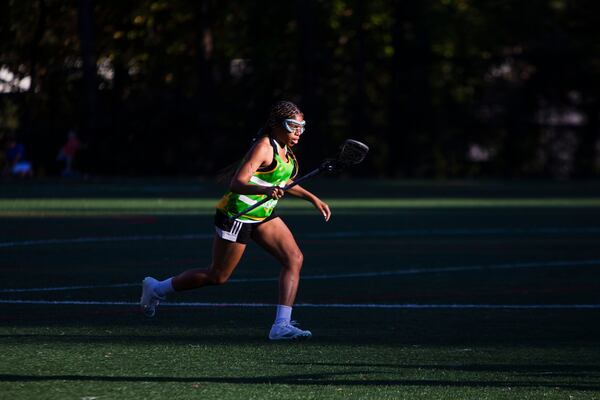 Kaitlin Britton-Wheeler, a 20-year-old Spelman junior, plays defense at a recent lacrosse match. 
"I just love team sports. Being a part of something bigger than yourself is something that everybody needs an opportunity to be involved in. This is a movement," Britton-Wheeler said. CHRISTINA MATACOTTA FOR THE ATLANTA JOURNAL-CONSTITUTION. 