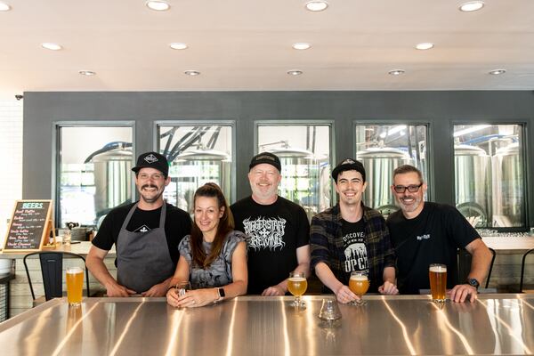 Biggerstaff executive chef Davis King, owners Sarah, Clay and Cole Davies, and director of brewing operations Chris Collier. (Mia Yakel for The Atlanta Journal-Constitution)