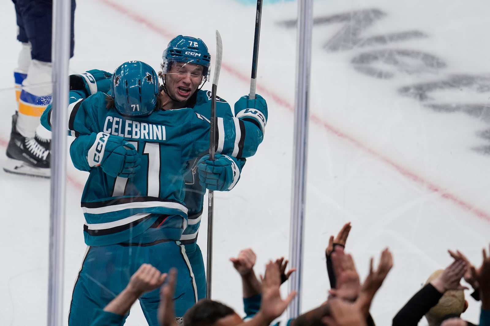 San Jose Sharks center Macklin Celebrini (71) is congratulated by left wing William Eklund (72) after his goal against the St. Louis Blues during the first period of an NHL hockey game Thursday, Oct. 10, 2024, in San Jose, Calif. (AP Photo/Godofredo A. Vásquez)