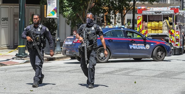 Atlanta police and a multi-jurisdiction police force swarmed Midtown Atlanta on Wednesday, May 3, 2023 after 5 people were shot.  (John Spink / John.Spink@ajc.com)

