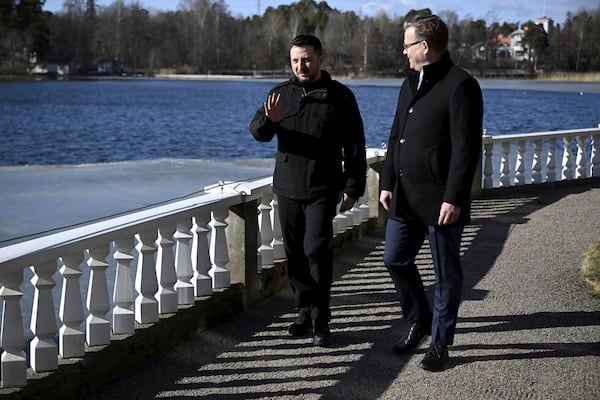 Finnish Prime Minister Petteri Orpo, right, and visiting Ukrainian President Volodymyr Zelenskyy talk at the Prime Minister's official residence Kes'ranta in Helsinki, Finland, Wednesday, March 19, 2025. (Antti Aimo-Koivisto/Lehtikuva via AP)