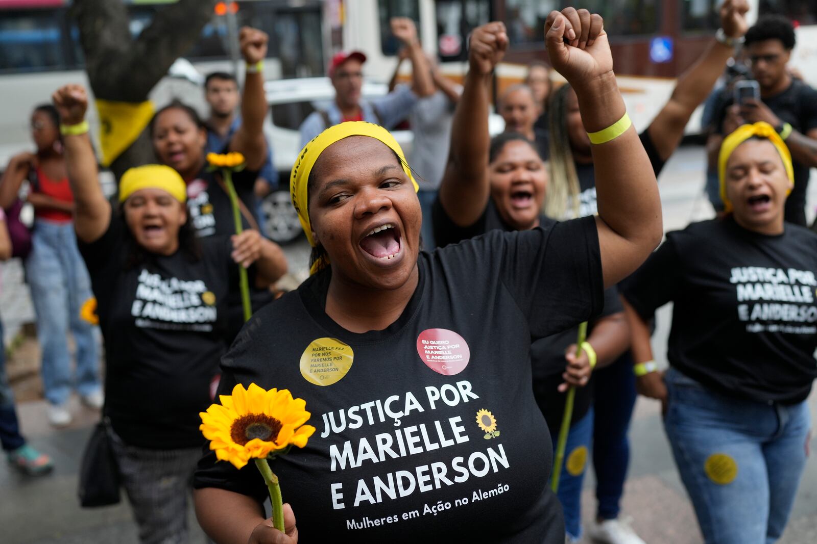 Activists attend a rally prior to the trial of former Rio de Janeiro city councilwoman Marielle Franco's alleged killers outside the Court of Justice, in Rio de Janeiro, Wednesday, Oct. 30, 2024. (AP Photo/Silvia Izquierdo)