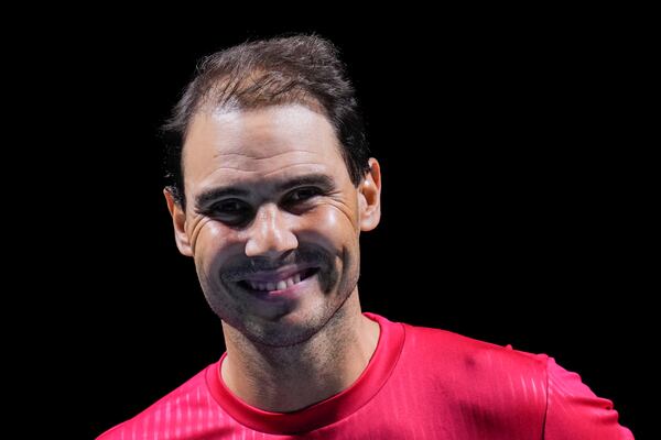 Spain's Rafael Nadal smiles during a tribute after playing his last match as a professional tennis player in the Davis Cup quarterfinals at the Martin Carpena Sports Hall in Malaga, southern Spain, on Tuesday, Nov. 19, 2024. (AP Photo/Manu Fernandez)