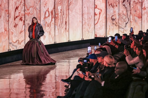 A model wears a creation as part of the Saint Laurent Fall/Winter 2025-2026 Womenswear collection presented Tuesday, March 11, 2025. in Paris. (AP Photo/Thomas Padilla)