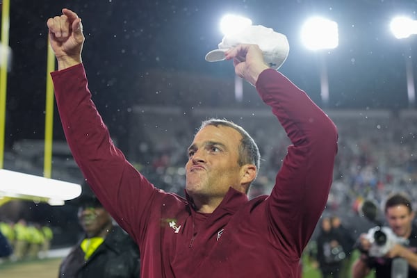 South Carolina head coach Shane Beamer celebrates the team's win after an NCAA college football game against Vanderbilt, Saturday, Nov. 9, 2024, in Nashville, Tenn. (AP Photo/George Walker IV)