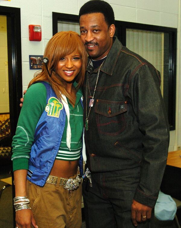 Ciara with her father, Carlton Harris, before performing at Riverdale High School in 2005. (AJC staff)