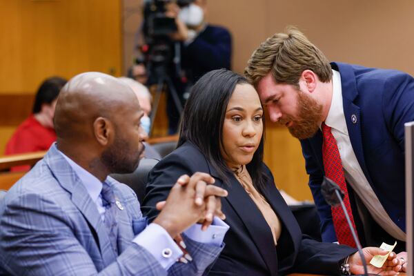 Fulton District Attorney Fani Willis (center) sat down for a far-ranging interview with AJC journalists Tamar Hallerman and Bill Rankin earlier this week. (Miguel Martinez/miguel.martinezjimenez@ajc.com)