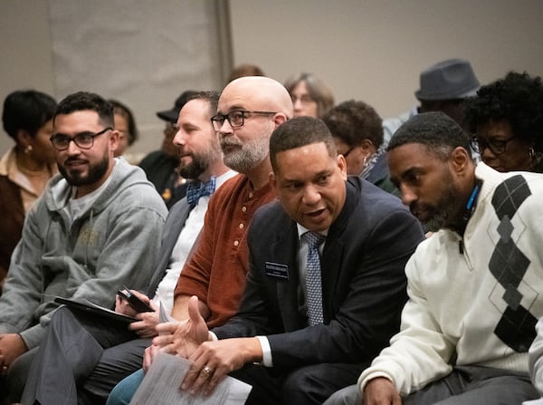 120619 MARIETTAâ  Jimmy Herndon, center, who is running for Sheriff of Cobb County, listens during a town hall meeting hosted by the ACLU of Georgia, Cobb County Southern Christian Leadership Conference and La Gente de Cobb to discuss the conditions at the Cobb County Detention Center Monday, Dec. 9, 2019 at Life Church in Marietta, Ga. PHOTO BY ELISSA BENZIE