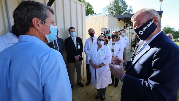 Gov. Brian Kemp (left) tours the temporary medical pod that has been placed at the North Campus of Phoebe Putney Health System with their CEO Scott Steiner (right) on Tuesday, May 5, 2020, in Albany. (CURTIS COMPTON / ccompton@ajc.com)