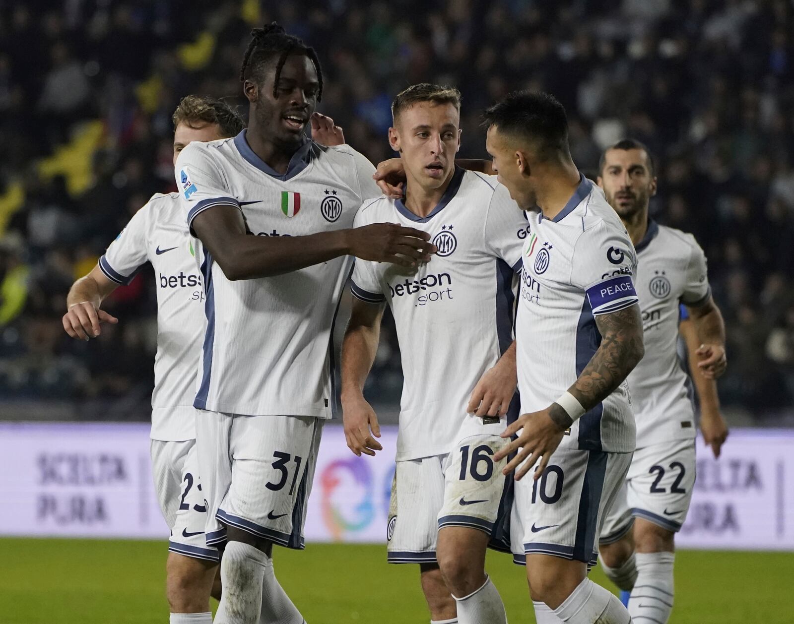 Inter's Davide Frattesi, center, celebrates scoring during the Serie A soccer match between Empoli and Inter Milan at the "Carlo Castellani Stadium in Empoli, Italy, Wednesday, Oct. 30, 2024. (Marco Bucco/LaPresse via AP)