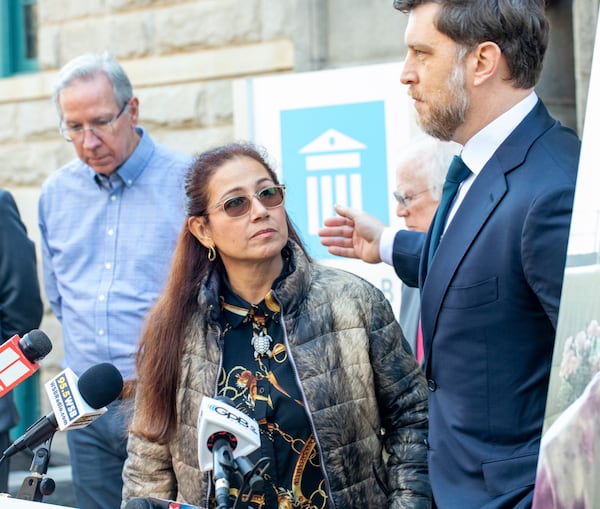 Belkis Terán, the mother of of Manuel Esteban Paez Terán, known as Tortuguita, is invited to speak by Attorney Jeff Filipovits, right, during a news conference outside the Decatur Courthouse, in Decatur, Ga., Tuesday, Dec 17, 2024. (Jenni Girtman/Atlanta Journal-Constitution via AP)