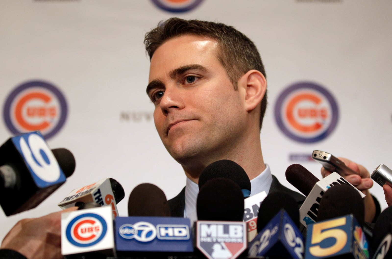 FILE - Chicago Cubs president Theo Epstein speaks to reporters during the 27th annual Chicago Cubs baseball convention, in Chicago, Jan. 13, 2012. (AP photo/Nam Y. Huh, File)