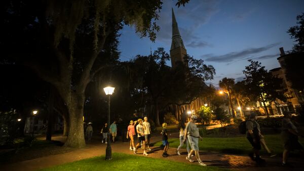 A ghost tour walks through the square formerly known as Calhoun Square in 2023.  