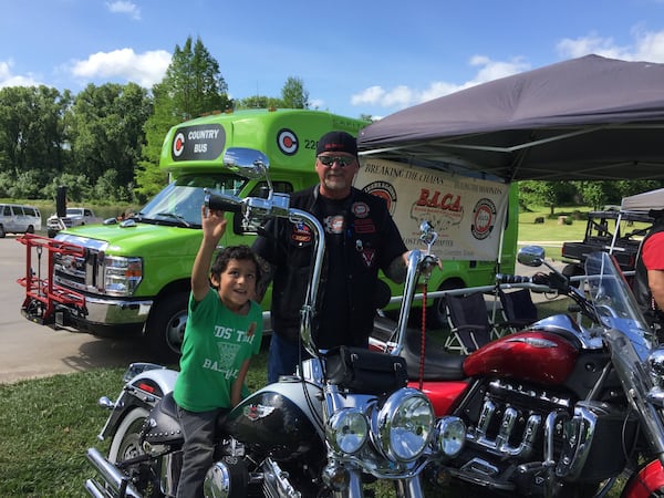 In this file phjoto, attendees at YMCA s Healthy Kids Day at Fisherman’s Park learned what it s like to sit on a big motorcycle with the motor running as part of information handed out at the event. DEBBIE MOORE/ BASTROP ADVERTISER