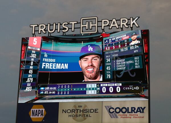 062422 Atlanta: The Truist Park screen shows former Atlanta Braves first baseman Freddie Freeman in Los Angles Dodgers blue while he bats against the Braves in a MLB baseball game on Friday, June 24, 2022, in Atlanta.   “Curtis Compton / Curtis.Compton@ajc.com”