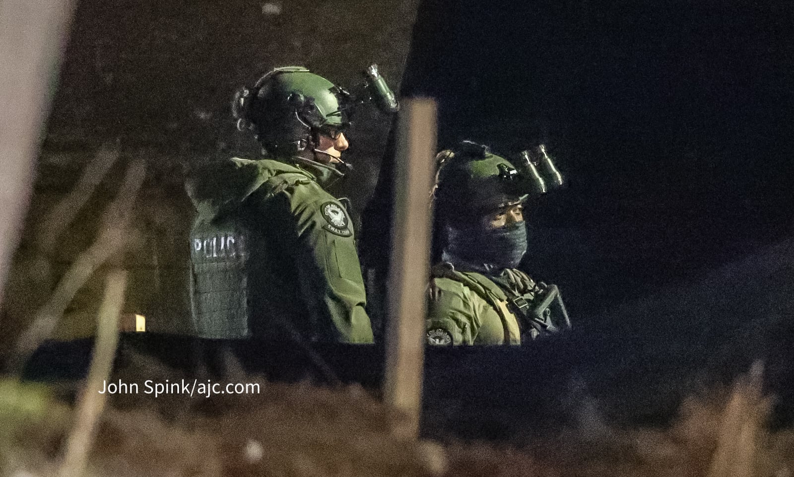 Atlanta police SWAT teams surround a home in the area of Joseph E. Lowery Boulevard just south of Martin Luther King Jr. Drive early Tuesday morning.