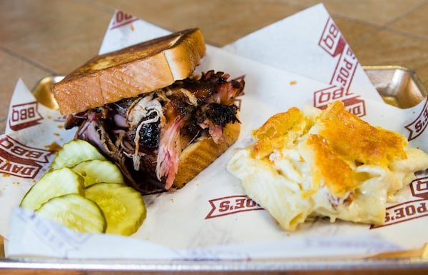 The pulled pork sandwich at Dave Poe’s BBQ in Marietta is served on Texas toast, paired here with mac and cheese (aka the side you don’t want to miss). CONTRIBUTED BY HENRI HOLLIS