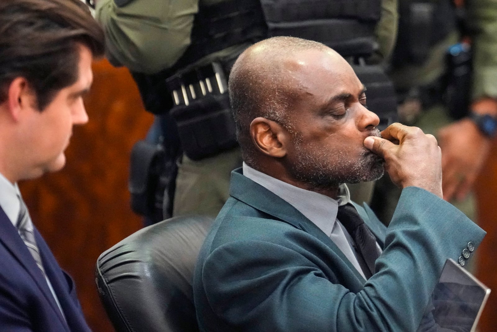 Former Houston police officer Gerald Goines sits in the courtroom after he was sentenced to 60 years behind bars on a pair of felony murder convictions on Tuesday, Oct. 8, 2024, in Houston. Goines was found guilty of felony murder in the 2019 deaths of Dennis Tuttle and Rhogena Nicholas. (Brett Coomer/Houston Chronicle via AP)