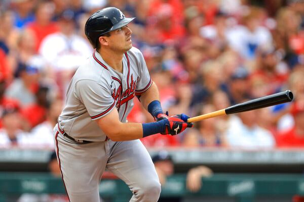 Atlanta Braves' Austin Riley watches his two-run home run against the Cincinnati Reds during the first inning a baseball game in Cincinnati, Friday, July 1, 2022. (AP Photo/Aaron Doster)